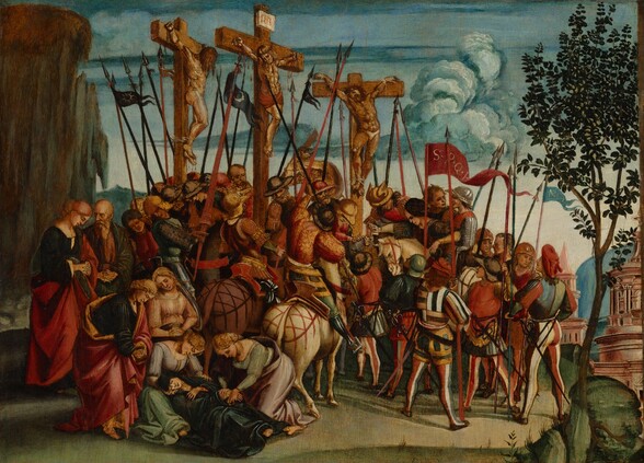 In this horizontal painting, a crowd of more than two dozen men and women gathered shoulder to shoulder at the foot of three men hanging from wooden crosses nearly fill the scene. All the people have pale or ruddy skin. To our left of center, each of the crucified men is tied and nailed to a cross. Blood pours from their hands and feet, and from a gash over the central man’s right ribs. The men’s heads slump and their bodies sag. They are nude except for a red cloth across the central man’s hips and a small white loincloth on the man to our right. Two of the men wear crowns of thorns. The spear piercing the central man’s side is held by a man riding a white horse in the crowd below. At least three additional men in the crowd are on horseback. Many of the men are armed with spears, creating a bristle of vertical and diagonal lines over the group. The men and women wear robes and uniforms in shades of golden yellow, pine green, crimson and rust red, black, and cream white. A few men wear metal helmets, and one wears armor. Near the lower left corner, a woman wearing a navy-blue robe has fainted and is supported by two kneeling women while another woman and cleanshaven man look on, their fingers interlaced and held low. The smooth ground is grass green. A spindly tree with dark green leaves grows up the right side of the composition. Off in the distance beyond the tree, two buildings hint at a city. Blue clouds billow in the blue sky above.