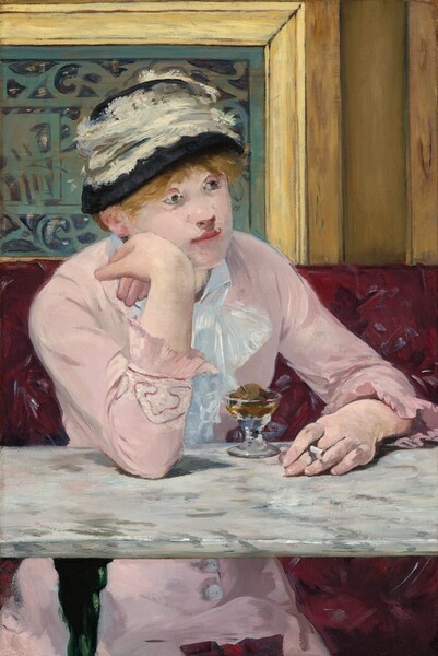 A woman with light skin sits facing us across a marble-topped table in a café in this vertical painting. Her body is angled slightly to our right, and she rests her right elbow, on our left, on the table. She leans her right cheek onto the back of her right hand as she gazes into the distance. She holds a cigarette in her other hand, which rests on the tabletop. Her pale pink dress has long sleeves with ruffles at the cuffs, and buttons down the front of the skirt can be seen under the table. A lace bow or ruffles cascade down at her neck. Straw-colored hair peeks out under a black hat encircled with a wide band of lace. A short, stemmed glass sitting on the table in front of her holds a small, round piece of fruit surrounded by caramel-colored liquid. The white marble tabletop is streaked with gray. The burgundy, patterned banquette she sits on takes up the bottom half of the composition, and wood paneling around a slate-gray metal grate fills the top half. Loose brushstrokes are visible throughout. The artist signed the work as if he had written his name on the surface of the table, near the front edge to our left, Manet.
