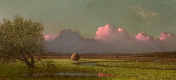 Tall, billowing, lavender-purple and shell-pink clouds line the distant horizon over a vast plain of flat grassy land in this horizontal landscape painting. Closest to us to the lower left, a tree with a gnarled trunk and round, sage-green canopy sits mostly in shadow. A river curves from near the tree to cut across most of the landscape in a tight S-shape. One plump haystack, shaped like a giant teardrop, sits near a curve of the river in the vivid, lemon-lime field, to our left of center. One brown and one white cow graze across the river, to our right. Above tawny-brown hills lining the horizon, sunlight from our left turns the tops of the band of clouds pale pink, and the undersides are grayish-purple. The sky above is turquoise. The artist signed the lower right corner, “M J Heade.”