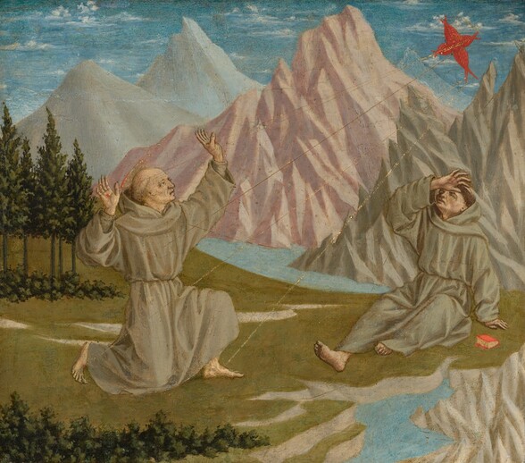 In a landscape with chiseled, rocky mountains beyond a grassy meadow and stream, two men wearing dove-gray robes react to a flame-red cross in the sky in this nearly square painting. Both men have pale skin and their hair has been cut into a ring around each head. Their loose robes are cinched at the waist, and both have bare feet. The man to our left, with hands raised, kneels with his body angled to our right, facing the red cross in the sky, in the upper right corner of the painting. He has gray or blond hair and a flat gold halo edged with red. Five thin gold lines emanate from the red cross to touch the man’s hands, feet, and the right side of his chest. There is a red spot where one gold ray touches the palm of his right hand, closer to us. The second man, to our right, sits and leans back on one hand and holds his other hand to his brow as he looks up at the cross. He has dark hair. A small book with yellow pages and a red cover sits on the grass nearby. In the background, each of the three tall, pointed mountains nearly touch the top edge of the composition, and each is a different color, with icy, pale blue to our left, shell pink at the center, and light laurel green to our right. A stream running in front of the mountains turns a corner and comes our way in the lower right corner of the panel. The green meadow has a line of dark pine green trees and bushes behind the kneeling man and along the bottom left edge of the panel, near us. Wisps of white clouds float in the violet-purple sky above.