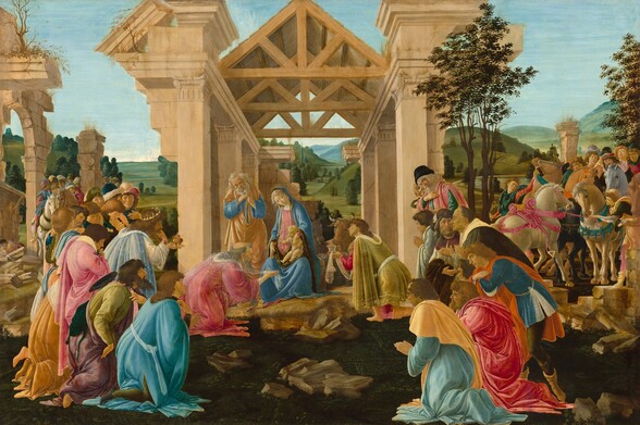 About three dozen people gather in a grassy field to either side of a crumbling structure to kneel and pray before a woman and baby in the center of this horizontal painting. The woman, Mary, and baby, Jesus, have smooth, pale skin while the others have light or tanned skin. The structure has sand-colored stone pillars, a wooden triangular, pitched roof, and a straw floor. Mary, who has an elongated torso, sits facing us with her knees apart. She wears an azure-blue robe over a rose-pink dress. A shell-pink veil covers her head and body. Jesus sits on her left knee, his pudgy body angled to our left. He is nude except for a transparent cloth wrapped over one shoulder and the opposite hip. Mary’s left hand braces his torso. On Mary’s right, our left, Joseph, an older man, stands facing us. He clasps his hands at his chest and leans on a long stick. He has wrinkled skin, long, gray curly hair, and a full beard. Both Mary and Joseph tilt their heads to their right, our left, as they look down at Jesus. Joseph wears a golden yellow robe over a blue tunic. Joseph, Mary, and Jesus have faint gold halos. Behind them, a brown cow and gray donkey rest on the straw. People closest to Mary and Jesus kneel and bow their heads while the people to the left and right sides mostly stand. Three men kneeling closest to Mary and Jesus offer gifts, including a bronze vessel and a gold jar. One man has long dark brown hair and a beard, and wears a gold crown. Another man is bald with long gray hair and beard, while the third is cleanshaven with shoulder-length brown hair. These men wear robes in powder blue, carnation pink, or celery green with delicate silver and gold embelishments. Others in the crowd range in age from young and cleanshaven to older and bearded. They wear robes and tunics in shades of raspberry pink, butterscotch yellow, lapis blue, plum purple, or forest green. Several horses, their coats white or cinnamon brown, stand among the crowd, a few with riders. To our right, one horse rears its head and two others stand facing each other. Beyond the crowd, grassy green meadows and hills dotted with trees lead back to the horizon. A pale blue sky fills the top third of the composition.
