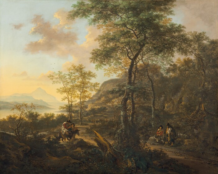 Warm light coming from the left illuminates four men standing in pairs on either side of a dirt road that winds between rocky, tree-studded hills and a misty river in this almost square landscape painting. The trees have tall, gnarly, brown trunks with high canopies of sage, olive, and forest green while others have golden yellow leaves. The road curves in a C-shape along the foot of the hills that rise up the right side of the composition, their craggy faces painted in warm tones of sand, fawn, and caramel brown. Closest to us is rocky terrain covered with scrubby plants and two moss-covered trees growing next to a broken tree trunk that separates us from the men. The trees are just right of center and divide the scene vertically. The two men to the right of the tree rest among boulders next to the road. One sits and the other stands, and each holds a tall staff. A light-gray, bearded goat lies to the right of the men and closer inspection reveals another grazing nearby. On the left, one man sitting astride a donkey turns his head away from us to look at the man standing just behind him. The men are all simply dressed in knee-length breeches, shirts, and sleeveless coats in shades of brick red, ivory, and tan, or ginger brown, and wear tall, wide brimmed hats. A man driving cattle approaches them from farther back along the road. Beyond the tall trees near the center, the hills slope down to a winding river fringed with trees. The river flows into the distance, past headlands jutting into the water, and ends at a tall mountain rising from the low horizon. A thin wash of butter yellow creates a hazy glow over the river, headlands, and distant mountain. A pale robin egg-blue sky scattered with petal-pink and dusty rose clouds fills the top of the scene.