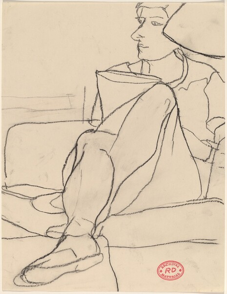 Untitled [woman seated on sofa with legs crossed]
