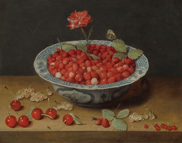A blue and white bowl with a flaring rim is filled with small red strawberries, and the currants and cherries scattered around it are arranged along a wooden ledge or table in this horizontal still life painting. A single, ruby-red and white carnation with a short stem has been stuck down into the bowl at the back center. A few green strawberry leaves lie among the berries near the flower. A butterfly with honey-yellow and black wings perches on one leaf to our right. The top edge of the bowl’s rim is painted with geometric designs in muted azure blue between roughly oval-shaped medallions painted with stylized flowers. The base of the bowl is painted with fruit within a rounded medallion. To our left of the bowl, six vibrant red cherries and three stems of pearl-white currants sit on the table. To our right is another sprig of white currants and one of gleaming, scarlet-red currants. Between them is a trio of strawberry leaves and a pair of strawberries. A fly has landed on one of those berries, near the bottom center of the composition. Several water droplets glisten on the leaves and tabletop. The background is dark, earthen brown.