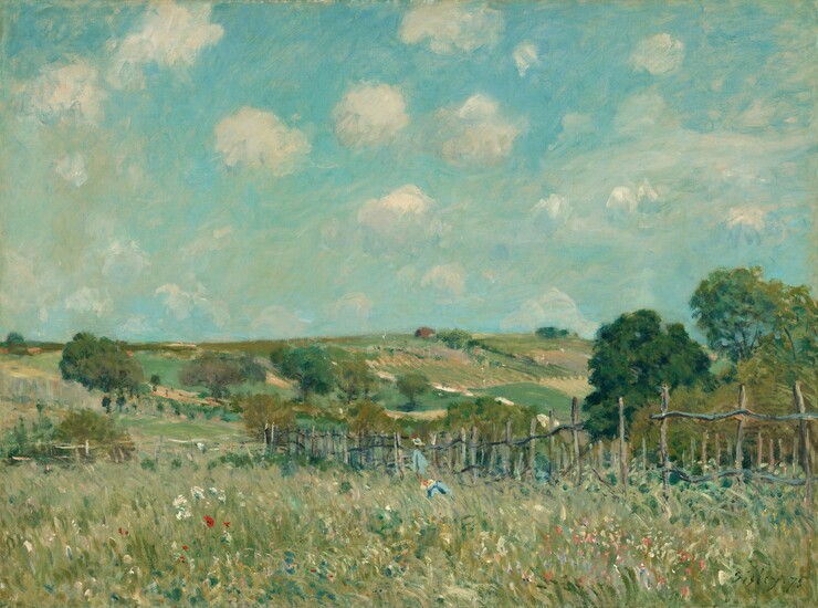 Painted in mostly in jewel tones of topaz and aquamarine blues, and sage, spring, and pine greens, a meadow is enclosed by a wooden fence, against a landscape of gently rolling hills under a vibrant sky in this horizontal painting. The scene is loosely painted with visible brushstrokes. Touches of white, cotton candy-pink, ruby-red, and azure-blue paint in the long grasses close to us could be wildflowers. A few swipes of straw yellow and pale and lapis blue could represent two people, standing and kneeling, in the field close to the fence. The rickety fence starts at the right edge of the canvas and extends into the distance, angling away from us to our left. Rolling hills beyond are a patchwork of emerald green and caramel brown, and are dotted with trees with full, dark green canopies. One brown building sits on the crest of a hill to our right of center. The horizon comes about halfway up this picture, and the turquoise-colored sky is dotted with white puffs of clouds. The artist signed and dated the painting in the lower right corner, “Sisley 75.”