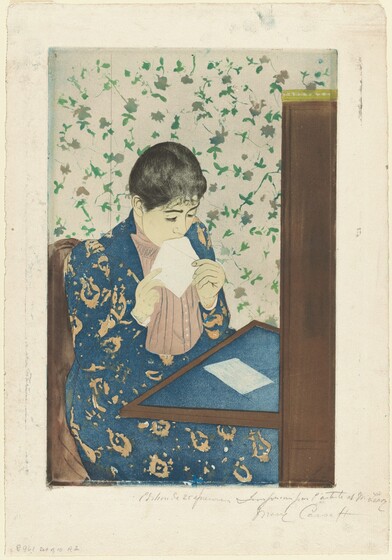We look slightly down onto a young woman sitting at a writing desk as she licks an envelope in this vertical, color print. A table folds down or extends from a tall secretary desk to our right. The blotter on the table and the woman’s long dress are both royal blue. The dress has a vaguely floral pattern in tan, and the jacket is open to reveal a vertically pleated, beige-pink shirt beneath. The woman’s skin is faintly tinted almost yellow. Her black hair is pulled back over dark brows and a delicate nose. She holds the open flap of the envelope to her mouth with both hands. A piece of white paper lies on the desktop in front of her. She sits in a brown chair, and the wallpaper of the room is patterned with green and muted brown flowers against a white background. The sheet is inscribed with graphite across the right half of the bottom margin, “Edition de 25 épreuves Imprimée par l'artiste et M. Leroy Mary Cassatt.”