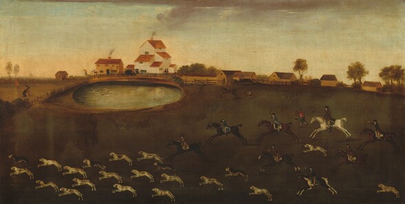 Twenty-one dogs run and eight pale-skinned men on horseback gallop from right to left across a grassy field in this horizontal landscape painting. Most of the dogs are white with tawny brown spots but a few are darker brown. At the back of the pack, some of the men raise riding crops over the brown, black, or white horses. The men wear tailcoats, shirts, riding pants, boots, and hats in shades of brown, blue, golden yellow, and black. A ninth man runs on foot, hat in hand as he gestures at something to our left. Another man chases after a rearing brown horse to our right beyond this group, and about a dozen waterfowl float in the oval lake in the near distance to our left. Further back, beige and tan houses with copper-colored roofs are enclosed by a fence. Plumes of dark smoke rise from the chimneys into the watery blue sky. An oversized brown rabbit sits to the left of the lake, out of scale with the rest of the picture. The overall tonality of the landscape is dark and murky, especially in the dark green of the lawn.
