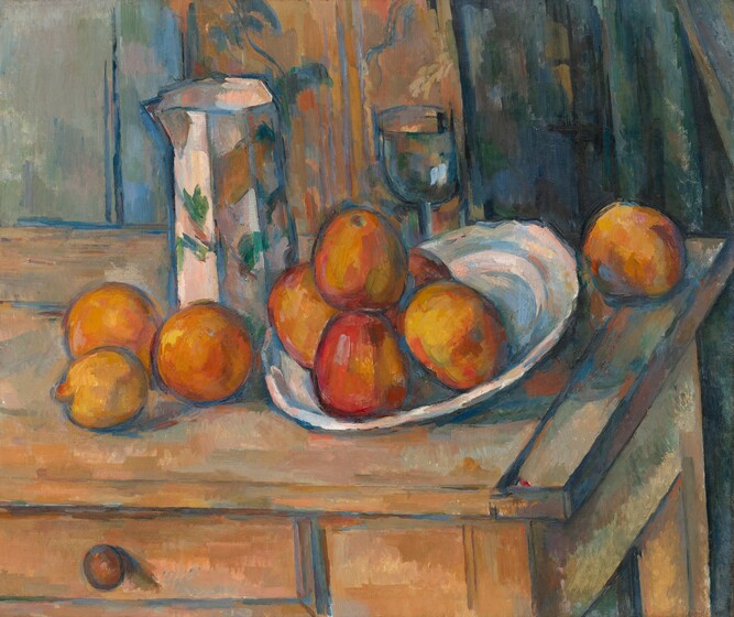 We look down onto nine pieces of fruit, a pitcher, a goblet, and a dish arranged on a rustic wood table in front of a floral curtain in this nearly square, loosely painted still life. The table extends off the left edge of the composition and the back, right corner of the table just touches the right edge of the canvas. At the center of the composition, five pieces of marigold-orange fruit with yellow highlights and scarlet-red shading are piled in the dish. The side of the dish to our right is slightly tipped up so the fruit settles near the rim to our left. The dish is painted with loose strokes of sky blue, shell pink, pale yellow, and parchment white. Three more pieces of fruit, including a lemon, sit to our left of the dish and one more piece of fruit sits near the back corner of the table, behind the dish, to our right. Immediately behind the dish is a stemmed glass with a tall, rounded bowl. To our left, between the fruit on the table and in the platter, is a tall, angular, tapering pitcher. The pitcher is painted with emerald and moss-green leaves against a background painted with strokes of light peach, blush pink, slate blue, and one wide stroke of amber orange. The wooden table is peanut brown streaked with strokes of apricot orange and pale sage green. One drawer at the front has a round, wooden pull. There seem to be at least two panels of curtains hanging behind the table. Down the center of the background is a panel of coral peach and saffron orange with a floral pattern painted in wheat brown and denim blue. To our right, the panel is streaked with vertical strokes of teal, midnight, and navy blue. The area to our left, behind the table, could be the panel of a door, painted with pale turquoise. The fruit, dish, vessels, table, curtain, and door are all outlined with cobalt blue.