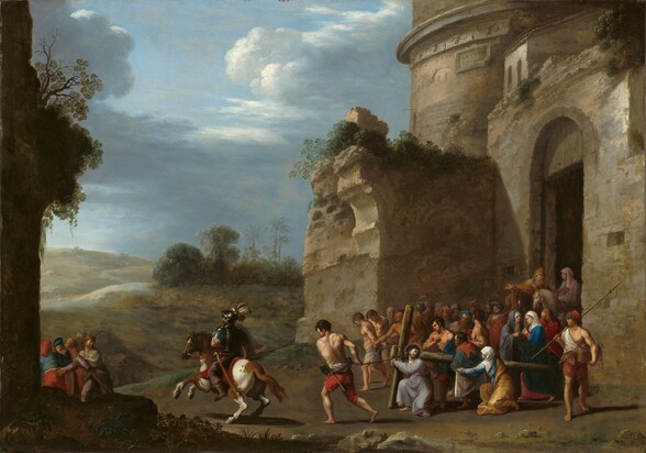 A tightly packed crowd of about two dozen men and women surges out of a fortified stone ruin in this horizontal painting. The building fills the right half of the composition and extends off the top edge. Shrubs and vegetation grow on fragments of architecture that loom behind the crowd. Near the front of the crowd, a man wearing a lilac-purple robe kneels, bracing the crossbeam of a wooden cross over one shoulder. He wears a ring of thorns on his head, and he looks back over his shoulder so his face turns to us. His fingers are interlaced over the crossbeam, which is tied with rope. A muscled, bare-chested man wearing ruby-red, knee-length britches and an ax tied around his waist pulls the rope. A woman wearing a blue dress, yellow robe, and white veil holds out a piece of white fabric to our right. Just beyond the cross, two men walk with their hands tied behind their back, their heads down. They are nude except for gray cloths tied across their hips. To our right in the crowd, a woman wearing a white head covering and rose-pink dress under a voluminous, azure-blue robe stands with her fingers interlaced. A second woman, in slate blue, stands next to her, looking at and pointing to her. The other men in the crowd wear turbans, feathered caps, or are bareheaded. Some wear tunics and some are bare chested. Two men on horseback bring up the rear of the crowd, under the tall rectangular doorway leading into the building. A man wearing armor rides a rearing, brown and white dappled horse in front of the crowd, to our left. Four men walk farther along the path where it disappears behind another fragment of a building, also overgrown with plants. More people, painted ghostly white, walk along the path where it curves into the deep distance between rolling hills. A grove with bushes, palm trees, and trees with rounded canopies grows in the distance to our right. White and flint-gray clouds roll across the pale blue sky above.