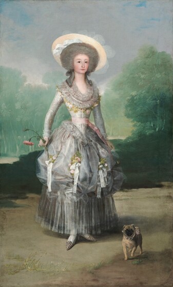 A woman with pale skin, wearing a silvery-gray dress adorned with white ribbons and light pink roses, stands looking out at us with a small, pug dog by her feet in this vertical portrait painting. The woman’s body is angled slightly to our right but she looks at us with dark eyes under faint, arched brows. Her nose is rounded, her cheeks smooth and flushed, and her pale pink lips are closed. Her face is framed in a cloud of nickel-gray hair, and tendrils curl down over her shoulders. She wears a wide-brimmed straw hat with a white ribbon set on the back of her head and slightly off to one side. The bodice of her dress has a low, curving neck. This area is loosely painted to create the impression of layers of lace. A band of intertwined pale pink roses and delicate green leaves borders the outer edge of the lace. The dress has long, tight sleeves with lace at the cuffs and the notably narrow waist is tied with a blush-pink ribbon. The full, silver skirt is picked up to create a row of puffs, like the top of a muffin, around her knees. Bunches of pink roses and white ribbons are nestled into the puffs, and below, the skirt falls in long, vertical pleats to her ankles. She wears white stockings and pointed, petal-pink shoes. In her left arm, on our right, she holds a closed fan loosely at her side, almost lost behind the skirt. She holds a pink carnation with a full bloom and a bud on a long, curving stem in her other hand, by her hip. A caramel-brown pug with a black face, wearing a pink collar lined with three bells, stands facing us with one front paw lifted, to our right of the woman's feet. The landscape is painted in tones of mint and sage green for grass beneath trees enclosing the space the woman stands in, sand brown for the ground, and icy blue for the sky above.