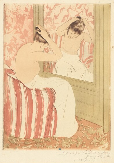 A pale-skinned woman, nude from the waist up, gathers her hair in her raised hands as she sits before a mirror in this vertical, colored print. The large mirror is to our right, and the woman’s body is mostly turned away from us. Her head is bowed but a loose tendril of brown hair hanging beside one cheek is reflected in the mirror. Her lower body is wrapped in a voluminous off-white cloth as she leans forward on a curved terracotta-red and white striped armchair. Her facial features, the contours of her body, and the folds of the towel are all delineated with thin strokes of tawny brown. The mirror is set into a tan wall, and the wall beyond and carpet below her covered with abstract floral patterns. The wall has a dusty-rose motif over lighter pink background while the carpet pattern is tan against muted dark pink background. The wall and chair are reflected in the mirror in paler tones. A mark with an oval, or a mirrored C, over an uppercase M, is stamped in royal blue at the bottom center of the print. The sheet is inscribed with graphite across the right half of the bottom margin, “Imprimée par l’artiste et M. Leroy Mary Cassatt (25 épreuves).