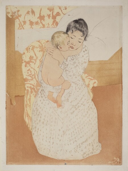 We look slightly down onto a young woman sitting in an upholstered chair and tightly hugging a nude, blond child in this vertical, colored print. Both have pale, peach-toned skin. The woman’s black hair is pulled back though a couple tendrils curl on her forehead. Her eyes are downcast and her pink lips parted. She wears a long, cream-white dress dotted with blush-pink, petal-like forms. One arm is under the baby’s chubby bottom and the other braces the child behind the shoulders. The baby wraps their arms around the woman’s neck so they are cheek to cheek. The chair sits in front of a bed with a boxy frame and a pillowy white mattress. The upholstery on the woman’s chair and the wallpaper behind her are patterned with dusky rose-pink flowers and vines against butter yellow. The floor is coral orange. A mark with an oval, or a mirrored C, over an uppercase M, is stamped in royal blue at the bottom center of the print.