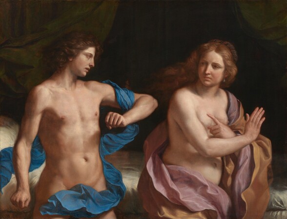 Shown from the thighs up, a light-skinned man and woman gesture dramatically, partially covered only by colorful lengths of loosely draped fabric in this horizontal painting. To our left, the man stands with his lean, muscled body facing us but he turns his face to our right in profile to look at the woman with his chin dropped. His thick, dark hair is brushed back. He has a long, straight nose and his lips are parted. His left arm, on our right, is raised to shoulder height, elbow pointed out at the woman, and that hand is clenched in a fist in front of his chest. His other arm is slightly bent at his side, that hand also balled into a fist. A narrow, vivid cobalt-blue cloth winds and flutters around his body from behind him to our left, over the raised arm, and across his hips. To our right, the woman stands with her back to the man, and she looks back over her right shoulder. Her copper-red hair blows back from her face, lifting off her shoulders. She has light brown eyes under lowered brows, and the corners of her pink lips are pulled slightly down. She wears a teardrop-shaped pearl earring from the ear we can see and a headdress wrapped with more pearls at the back of her head. Her body is pale, soft, and rounded. Her arms bend at the elbows to cross in an X-shape in front of her bare breasts. With her left hand, closer to the man, she points an index finger at him. Around her body swirl two layers of satiny draperies, the outer one a honey orange, and an inner layer in dusty pink. Both people are lit from our right brightly enough to create deep shadows. Behind them, a bed at hip height has ivory-colored linens and a dark green drapery hanging to each side. The space recedes into darkness beyond the bed, contrasting with the brightness of the people.