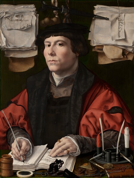 Shown from about the waist up behind a forest-green desktop, a man with smooth, pale pink skin writes in an open book with a quill pen as he looks at us, surrounded closely by papers, pens and ink, and other objects in this vertical portrait painting. His body is angled a little to our left but he tips his head slightly back and looks at us from the corners of his dark brown eyes under arched brows. He has a short, round nose, high cheekbones, and his pale pink lips are slightly pursed. His short, chestnut-brown hair curls over his ears, and bangs sweep across his forehead. His black beret is adorned over his right eyebrow, on our left, with a metallic badge with an intertwined I A S. He wears a crimson-red jacket with puffy red sleeves decorated with black bands. Black lapels open onto a dark garment that has a pewter-gray panel over the upper chest and gray sleeves. The white garment beneath peeks out along the neckline and cuffs at his wrists. His left hand, on our right, rests with fingers extended on a page with writing in the open book, and he wears a gold ring incised with “IS” on his forefinger and a gold band with a ruby-red gem on his pinkie. He writes the beginning of a word with his other hand. In front of him, on the ledge, is a talc shaker pierced with tiny holes in the top, a magnifying glass, a black inkpot, and a small pair of scissors. Near one elbow, to our right, is a pile of coins, a pair of scales with weights, a small leather-bound book, and a receptacle for rolled-up paper and quills. A thick sheaf of curling, crinkled papers hangs to either side of his head. The stack to the left is marked “Alrehande Misseven” and the stack to our right is labeled “Alrehande Minuten.” A black dagger, a tassel, and a set of at least four orbs about the size of ping pong balls hangs between the sheafs, against the dark background.