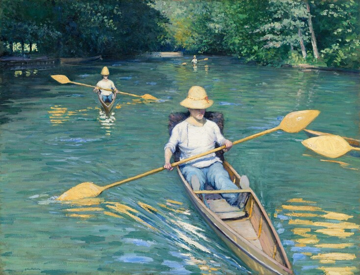 We look slightly down onto the surface of a river in which three narrow canoes, each paddled by a single person, are being rowed toward us in this horizontal landscape painting. The rowers wear white shirts rolled up to the elbows, light blue pants, and straw-yellow, wide-brimmed hats pulled down over the eyes. They sit in the bottom of their boats with legs extended and the handle of the double-bladed paddle straddling the boat over their laps. The canoe closest to us comes almost directly toward us, angled slightly to our right as it cuts through the surface of the river, its tip extending off the bottom edge of the canvas. The second canoe is a couple of boat lengths behind and to our left of the closest canoe. The third is small in the distance, near the horizon that comes three-quarters of the way up the composition. The back end of a fourth canoe and a single paddle extends into the scene from the right edge of the canvas. The butter-yellow paddles are reflected in the pale sage green and sky blue of the river’s surface. The river is lined on both sides with lush trees and vegetation, which fills the top quarter of the painting above the horizon.