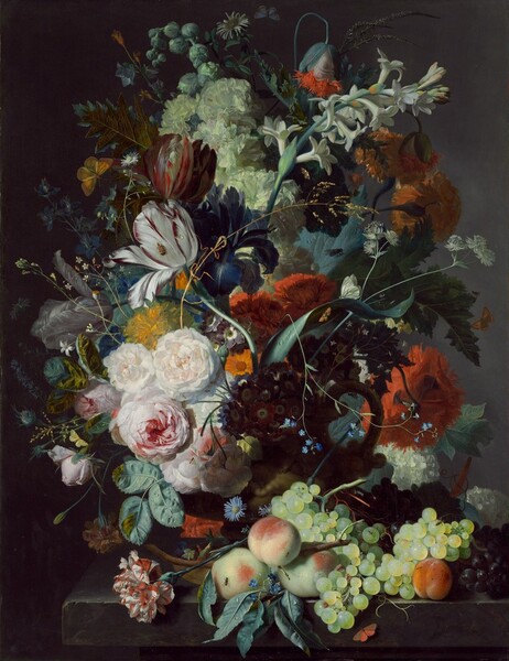 Against a dark background, an abundant, colorful arrangement of flowers and fruit fills this vertical still life painting. Set on a stone ledge, a barely visible terracotta vase contains the overflowing bouquet of flowers and greenery. Carnations, tulips, peonies, roses, tuberoses, hops, and other flowers create swirling, circular patterns that sweep across the panel. A delicate stalk of wheat and a few long, thin stems create bright, sinuous lines that span the composition. Peaches and green and purple grapes are piled on the ledge to our right, and an orange butterfly perches below. Barely noticeable, small, pale blue, yellow, white, and orange butterflies hover around the arrangement, while small insects and flies crawl on a few of the flowers and pieces of fruit. Drops of water reflect the light on some of the greenery, fruit, and tulip petals. The flowers are strongly lit across the face of the arrangement, which creates deep shadows to the sides and back.