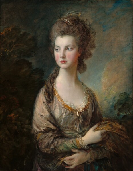 Seen from the hips up, an elegantly dressed woman with smooth, pale skin and ash-brown hair piled high on her head looks off into the distance to our left in front of a loosely painted landscape in this vertical portrait. Her body is angled to our right but she looks in the opposite direction with clear blue eyes under faint eyebrows. She has rosy cheeks, a small nose, and bow-shaped, apple-red lips set in an oval face. Her hair is streaked with caramel-brown and smoke-gray, and is arranged in a high updo with a long curl resting over the front of her right shoulder, to our left. A string of silver pearls are wound through her hair at the top, and a few strokes of bronze-colored and white paint faintly suggest a veil or other head covering at the back of her head. Her dress is also loosely painted with dashes of pewter gray and honey gold. The low, curving neckline and cuffs of the long sleeves are edged with gold ribbon and ivory-white ruffles. A jewel, possibly a large pearl, hangs at the center of the neckline on her chest. She crosses her wrists across her waist and holds the fabric of the dress in one hand and a piece of bronze-gold fabric with the other. The landscape behind her has pine-green trees framing a deep, topaz-blue sky with parchment-white and pale peach clouds.