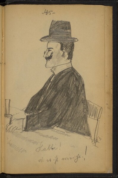 Man Wearing a Hat Seated at a Table