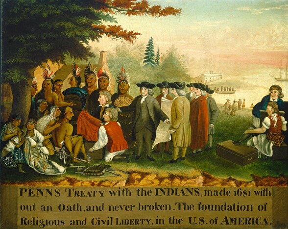 Eight pale-skinned men and thirteen brown-skinned, indigenous Lenape men, women, and a baby gather on a grassy field close to us in this horizontal painting. The white men are cleanshaven and have puffy gray, shoulder-length hair. Most wear black tricorn hats, and they all wear coats, vests, and pants in shades of tan, gray, red, brown, and white. An unfurled scroll in the middle of this group reaches from shoulder to calf, and most of the word “Pennsylvania” is legible there. Two bareheaded men kneel in front of the Lenape, holding a bolt of red cloth. The Lenape men wear black, red, and white feathered headdresses and gold earrings. Some are bare-chested and others wear furs or other garments in black or white. Three men are seated and look at the group of white men beyond the bolt of cloth. Others stand and look on, as two women and a baby sit in a trio to our left, under a tree. The women wear beaded headdresses and wear white or blue. One of the seated Lanape men holds a long, white clay pipe that spouts smoke from the short bowl. A bow and a quiver with arrows lies on the ground nearby. All the people are painted simply with large eyes, rounded lips, and oversized noses. To our right of the whole group, a pale-skinned man sits on a wooden chest with one foot resting on another chest. A second man there leans on another box or piece of furniture, and both look to our left. The grass slopes gently down to an ivory-white body of water in the distance. White and Lenape men meet near the shoreline. A boat carries seven people between us and a long white, two-storied building on the far shore. The sky above is pale pink along the horizon with wispy white clouds kicking up under an ice-blue band of sky along the top edge of the canvas. Closer to us, the grassy plateau ends with a shallow, rocky ledge. Text painted in a gold-brown field below the scene reads, “PENNS TREATY with the INDIANS, made 1681 with out an Oath, and never broken. The foundation of Religious and Civil LIBERTY, in the U.S. of AMERICA.” The surface of the canvas is cracked in some areas and is especially noticeable in the sky.