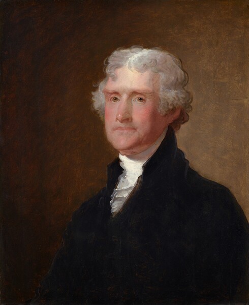 Shown from the chest up, a clean shaven, middle-aged man with pale, rosy skin and curly, pewter-gray hair, looks at or toward us against a caramel-brown background in this vertical portrait painting. His body is angled to our left, and he turns his face slightly to look our way with honey-brown eyes under straight, faint eyebrows. He has a long, prominent nose, and his pink lips are closed in a straight line. His gray hair is parted in the middle, curls around his face, and down the back of his neck. He wears a bright white, high-necked, ruffled shirt under a velvety black jacket. Light illuminating the man from our left creates a golden glow on the light brown background behind him.