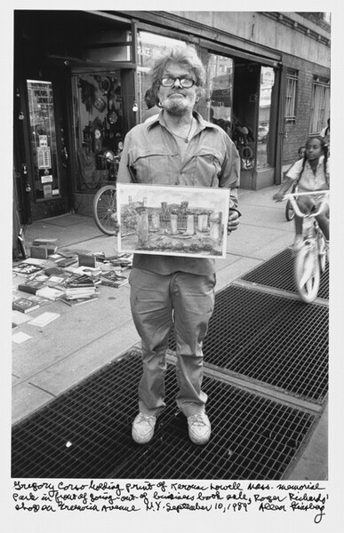 Gregory Corso holding print of Kerouac Lowell Mass. Memorial Park in front of going-out-of-business book sale, Roger Richards
