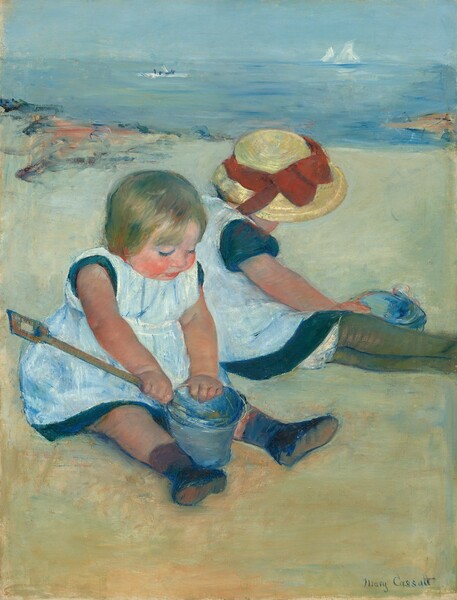Two pale-skinned little girls sit back-to-back on a sandy beach, almost filling the width of this vertical painting. The girls wear matching pale, ice-blue pinafores over short sleeve, ocean-blue dresses. Both sit with their legs stretched in front of them and angled to our right. The girl closest to us, to our left, looks down at the denim-blue pail and wooden shovel she holds between her ankles. She holds the long-handled shovel in her near hand with the end inside the pail. She has a chubby, flushed, round face with blond hair and rosy arms and legs. She wears black shoes and appears to have a brown sock on her near leg but a dark blue sock on the other. Her companion sits just beyond her and to our right with her body turned away from us. Her wide-brimmed straw hat is trimmed with a tomato-red ribbon tied in a bow at the front. The hat hides her face, and her outstretched legs are encased in olive-green stockings. Her near hand reaches across her lap to grab the pail sitting on the far side of her legs. The beach meets the pale blue and aquamarine ocean in the upper third of the painting. A patch of strokes and daubs of dark blue and peach near the upper left and a tan wedge in the water to our right are painted loosely along the shoreline. Two white sailboats and a horizontal white dash with three dark blue dots drift on the water. The artist signed the lower right, “Mary Cassatt.”