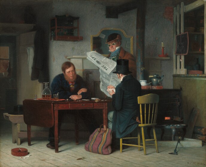 Two men play cards at a wooden table in a tavern while a third stands on the far side of the table between them, wearing green-lensed glasses and reading a newspaper in this horizontal painting. The men have pale skin and ruddy cheeks. The man on our side of the table sits with his back to us in a wood chair painted mustard yellow. He wears a black top hat and a long-tailed coat. He looks down at the splayed playing cards he holds in one hand and he touches the top edges of the cards with the other. A striped traveling bag leans against the table leg next to his chair. Across from him and facing us, a bearded man leans onto the table, arms folded and cards in one hand. He looks at the other player with squinting eyes and lips parted. He wears a blue coat over a striped shirt, and a silver ring on the third finger of one hand. He holds his stacked cards face down that hand and rests the other hand in that elbow. A black top hat sits brim-down on the bench next to him, and, under the table, the toes of the foot we see tilt upward. At least six silver coins and more cards are on the table. A coin purse is near the man wearing black, and a long tray holds an open decanter and a glass, both filled with amber-brown liquid. A silver object, perhaps the handle of a spoon, is propped in the glass and the stopper for the decanter is next to the tray. The man reading the newspaper wears a fur-lined cap and a brown coat over a high-collared white shirt. His neck is wrapped in a blue scarf dotted with white, which is tied at his throat. The newspaper droops toward us to show the masthead, which reads “THE SPY.” In the room behind the trio, a pewter teapot and white teacup sit on a wood-burning stove and shelves hold bottles and small barrels. A snuffed candle is on a shelf next to the stovepipe, near a chalk board about the size of a piece of copier paper. Someone has drawn a man’s bearded face with white chalk on the board. Two postcard-sized papers are tucked into a gold-framed, arch-topped mirror behind the standing man. A few bits of broken white smoking pipes are on and near a round, rust-red container on the wood-plank floor, to our left of the table. The artist signed and dated the work in the lower right corner, “R.C.W. 1851. Paris.”