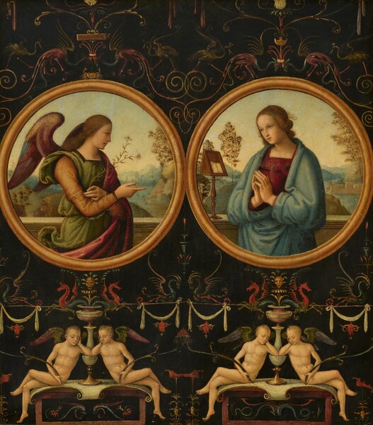 Two round, gold frames each show a person from the waist up in this nearly square painting. The rest of the panel is filled with vegetal and animal designs against a black background. A pair of nude winged angels are beneath each “framed” picture. All the people have pale skin and delicate features. The two people in the frames, Gabriel and Mary, have honey-brown hair and the pairs of angels below have short, blond hair. In the circular frame to our left, Gabriel looks to our right in profile. Plum-purple wings curve up and out from the shoulders. Gabriel wears a sage-green garment with harvest-yellow sleeves and a raspberry-pink robe. A stem of white lilies is held in one hand and the other gestures to Mary, to our right. Mary’s body is angled toward Gabriel, and she looks off to our left. She wears a garnet-red dress under a light blue robe, and her hands are together in prayer. A stone ledge runs behind both Gabriel and Mary, and a lectern holding a book sits on the ledge behind Mary. Behind both Mary and Gabriel, distant hills lead back to bodies of water that wind around rocks and buildings to hazy mountains along the horizons. A tiny gold crab perches on the top of the frame above Gabriel. Pelican-like birds and dragon-like creatures are surrounded by swirling vines and swags above and below the frames. The two pairs of angels take up the bottom third of the panel. The two angels in each pair mirror each other. The angels sit with their knees facing opposite directions, their knees crossed away from us, on altar-like structures. The left pair of angels have olive-green and mauve-pink wings, and the other pair have green and lavender-purple wings. All four have their eyes closed. Each altar is covered with a gold-edged, white scroll. All four angels rest one elbow on the rounded body of an urn sitting on the altars. The angels rest their chins in those hands, and each holds a scrolling vine with the other hand. The vines meet in the middle to support a flaming cauldron.