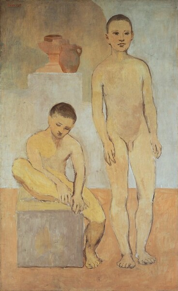 A nude boy or young man sits on a gray box and hunches over his foot, next to a second nude boy who stands facing us in this loosely painted, vertical scene. Both boys have light skin with a yellow cast, and their bodies are outlined with delicate brown lines. They both have short-cropped brown hair, and their facial features are sketched in with brown paint. To our left, the boy sitting on the box looks down at his right foot, on our left, which he holds up on the box with both hands. Next to him, the second boy stands with his arms down by his sides and he looks off into the distance to our right. The room is undefined but has a pale, rust-red floor. Behind them, a terracotta-red urn and jug sit on a platform, possibly in a niche in the silvery-gray wall. Brushstrokes are visible throughout. The artist signed the painting in red letters in the upper left corner: “Picasso.”