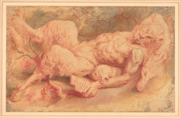Drawn with red and black chalk on cream-colored paper, a satyr has a man’s muscular upper body and the legs of a goat as he lies sprawled on his back across the width of this horizontal sheet. He lies with his head to our right and hooves to our left. His right arm, farther from us, is flung over his head and with that hand, he touches the sheep’s skin on which he reclines. The sheep’s head rests near the satyr’s shoulder. The satyr’s eyes are blank under lowered, deeply furrowed brows. His nose is bumped over the bridge and pointed at the end. His full lips are open to reveal his tongue and lower teeth over a cleft chin. A mustache or goatee is loosely drawn, and hollows in his cheeks suggest high cheekbones. A wine skin, like an oversized hot water bottle, is tucked under the hollow of his lower back. His left arm, closer to us, lies along the side of his body, and he holds a pan flute in that brawny hand. He has the furry haunches of a goat, and his legs are splayed so his hooves reach into the upper and lower left corners of the sheet. A grapevine with a few clusters of fruit curls behind his lower limbs and meanders across the background. Gray washes and sketchy lines are layered behind the vine. A tiny uppercase “R” appears to be penned near the lower right corner. Lower in that corner, a round stamp has a crown over an uppercase “W” above the letters “JCR.”