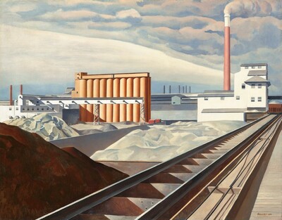 This nearly square painting shows an industrial area with buildings, storage silos, a smokestack, and railroad tracks. A mound of brown dirt or other material is in shadow in the lower left corner of the painting. Next to the mound, railroad tracks extend diagonally from the lower center of the painting into the distance to our right. The tracks end at a white building with staggered gray rooflines to our right in the distance. A tall terracotta-red smokestack rises high beyond the white building, smoke pouring out of its top and blending into the clouds above. Just beyond the mound of dirt, piles of white material, perhaps in unseen bins, line the railroad track to our left and lead back to a row ten interconnected, coral-orange silos. The horizon comes about halfway up the painting, and it is lined with a row of long white and gray warehouses. The artist signed and dated the work with brown paint in the lower right corner: “Sheeler 31.”