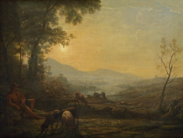 A man with tanned skin is surrounded by animals as he reclines against a grassy slope in this horizontal landscape painting. The area close to us is darkened or in shadow, so some details are difficult to make out, but the land brightens under a golden sky as it recedes into the deep, hazy distance. In the lower left corner of the canvas, the man faces our right in profile, looking toward the grazing animals. He wears a wide-brimmed hat and a caramel-brown jacket over a knee-length garment. He leans back on his near arm with one leg bent and the other extended. His far hand lies across his torso and holds a short staff. A dark brown goat, tan-colored sheep, and brown and gray cows wander and nibble on muted green, scrubby growth that carpets the hilly ground, which stretches across the center and right side of the composition. Trees with laurel-green canopies grow up beyond the man, and extend off the top edge of the painting. A slender, almost leafless tree frames the scene on the right. Two men walk on a gently arched, stone bridge beyond the spindly tree. Low hills slope down to a misty blue-gray plain, where a river winds along a jagged bank dotted with trees. In the far distance, ghostly buildings stretch along a line of slate-blue mountains. A glowing sun in the upper left corner casts diffused light across the scene. The sky is scattered with wisps of thin clouds.