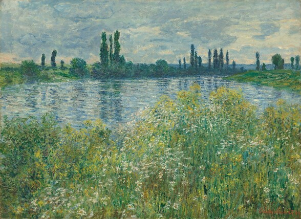 We look across a strip of tall grass and flowers at a river that winds into the distance in this loosely painted, horizontal landscape. The lower half of the composition is a mass of tall wildflowers created with daubs of lemon yellow and white among vertical strokes of moss, laurel, and pine green. The river beyond is painted with horizontal dashes of arctic, denim, and cobalt blue. The horizon comes about two-thirds of the way up the composition and is lined with tall, narrow trees, trees with rounded canopies, and a blanket of green growth loosely painted and shaded with touches of blue. The sky above is painted with blended strokes of slate blue and cream white. The sky is paler to the right, suggesting sunlight breaking through some of the clouds. The artist signed and dated the painting with red in the lower right corner: “Claude Monet 80.”