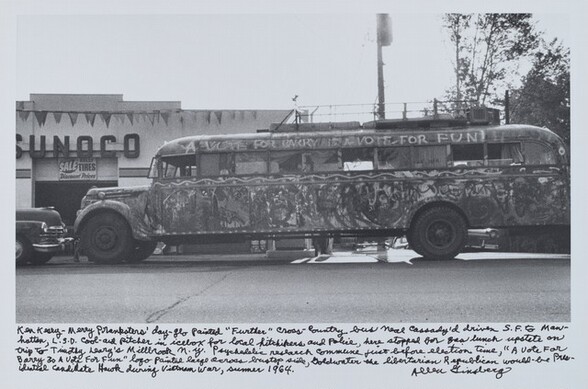 Ken Kesey—Merry Pranksters’ day-glo painted “Further” cross-country bus Neal Cassady’d driven S.F. to Manhattan, L.S.D. cool-aid pitcher in icebox for local hitchhikers and Police, here stopped for gas lunch upstate on trip to Timothy Leary’s Millbrook n.y. psychedelic research commune just before election time, “A Vote For Barry Is A Vote for Fun” logo painted large across bustop side, Goldwater the libertarian Republican would-be Presidential candidate Hawk during Vietnam War, summer 1964.