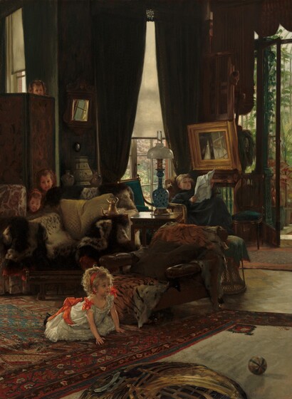 A young girl whose blond curls catch the sunlight in an otherwise dim living room looks up from a kneeling position on all fours on the floor as the faces of three other children peek over pieces of furniture behind her, and a woman leans back in a chair reading a newspaper in the background in this vertical painting. The children and the woman all have peachy, pale skin. The young girl’s body is angled to our right and she looks in that direction with eyebrows raised. She has a pointed nose, rounded cheeks, and her rosebud lips are closed. Her mass of blond curls is held back with a scarlet-red ribbon, and more red ribbons are tied into bows at the shoulders of her short-sleeved, white dress and around her waist. Her dress has lacy ruffles down the front and along the bottom hem. She kneels on a large rug patterned densely with burgundy-red, denim blue, and ivory-white stylized flowers, vines, and leaves. A red, blue, and white striped ball rests on a second patterned rug in front of her, to our right. In front of the girl and along the bottom center of the painting is a round but indistinct object, like a flattened basket, that sits on or is part of the carpet. A chocolate-brown, leather chaise lounge behind the girl is covered with at least one tiger’s pelt. A wooden side table separates that chair from another overstuffed armchair covered with more furs. Next to it, a third chair with a red paisley pattern against a white background is mostly cut off by the left edge of the canvas. Almost lost in shadow, two small faces peek out from between the two leftmost chairs. Both children have rounded cheeks and they look toward the kneeling girl. The forehead and nose of a fourth child’s face peeks over tiny fingers hooked along the top of the screen behind that pair. All three have brown hair pulled back in headbands. Farther back in the room to our right, a young woman with light brown hair, wearing a dark, long-sleeved, high-necked dress, reads her newspaper with her feet propped on a footstool in the back corner. A tall window behind her, to our left, is partially covered by a sheer white shade, and a glass door on the adjoining wall, to our right, opens onto a conservatory or greenhouse filled with green plants. The windows are framed covered by moss-green curtains. More side tables, chairs, and footstools line that back space. A long-necked, blue and white lamp with a glass shade sits on the side table next to the chair with the tiger pelt, and a gold teapot with white teacups and urns sit on other tables. A small, square mirror reflects bright sunlight next to the screen and another mirror with a wide, gold frame hangs above the reading woman and reflects the window panes behind her. The artist signed the work near the lower right corner, “J.J. Tissot.”