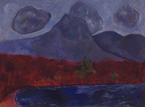 Amethyst-purple mountains and clouds against a slightly lighter, lavender-purple sky loom over a strip of land painted as a band of brick red over a field of royal blue, suggesting a body of water, in this abstracted, horizontal landscape painting. One tall peak with a flattened top rises in front of a few more lower, rounded peaks to our right. Round clouds, like cotton balls, in the same amethyst-purple of the mountains, float against the lighter purple sky. The sky, clouds, and mountains are painted with areas of mottled purple over a red underlayer, all outlined in lapis blue. The horizon line created by the strip of deep red land comes about halfway up the composition. A pair of green trees with triangular canopies, like pine trees on tall brown trunks, sits at the water’s edge near the center of the red band. A few touches of forest-green nearby suggest more trees or bushes. The red band is streaked vertically with visible brushstrokes in flame, ruby, and burgundy red. Along the bottom edge of the painting, the land curves toward us near the lower left corner, creating an elongated blue oval that reaches off the bottom and right edges. This area is painted with horizontal streaks of cobalt and navy blue with a few thin, white lines to suggest ripples. The artist signed and dated the painting in the lower right corner: “M.H. 42.”