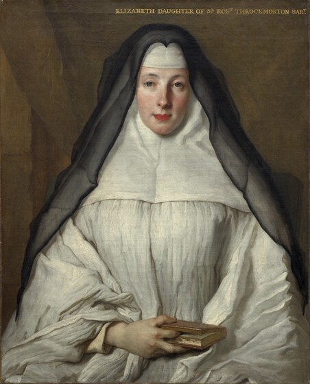 Shown from about the lap up, a woman with light skin sits facing us as she wears a voluminous garment that covers her head and forehead beneath a black veil that falls over and past her shoulders in this vertical portrait painting. The light comes from our left, illuminating her smooth skin and flushed cheeks. She looks at us with gray eyes under gently arched brows. Her coral-pink lips are closed and possibly pulled back slightly at the corners. Her garment is pleated across the chest and sleeves to fall in full folds over her arms. A wide panel covers her shoulders, the sides of her neck, and head, and a white band crosses her forehead. The semi-transparent black veil creates a stiff peak over her head where it attaches to the top of this garment, called a wimple. Her right hand, on our left, rests in her lap and her index finger marks her spot in the small book she holds. The other hand is presumably tucked under the folds of her garment. The background behind her is peanut brown, and a diagonal line suggests a curtain pulled to our right. An inscription in capital gold letters spans the right half of the painting along the top edge: “ELIZABETH DAUGHTER OF SR ROBT THROCKMORTON BART.”