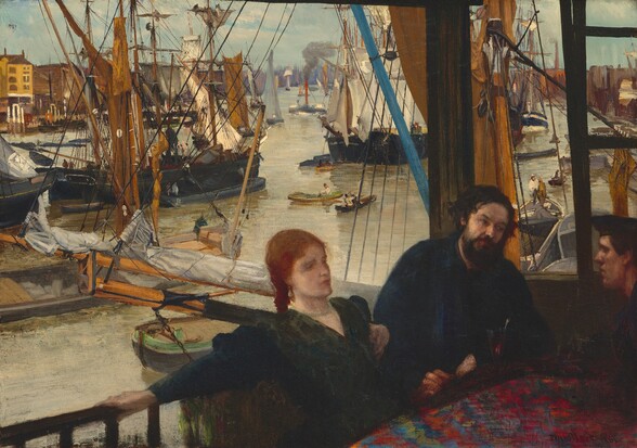 We look slightly down at a woman with pale skin and two men with ruddy complexions sitting at a table near a railing overlooking a boat-clogged waterway in this horizontal painting. Only the corner of the table is visible in the lower right corner of the canvas. The woman sits next to one man on the far side of the table, and the third person leans onto the table from our right, along the edge of the composition. The table is covered with a dark, ruby-red, floral cloth. The red-haired woman wears a dark green dress and leans back, extending her right arm along the railing. Her back is to the river below, and she gazes directly ahead, to our right. The dark-haired, bearded man sitting to her left, our right, leans toward the cleanshaven, dark-haired man sitting across from him. That second man wears a cap, and he has a prominent nose and square jaw. Sailboats, rowboats, a steamship, and vessels of every size occupy much of the waterway. Rows of buildings extend along the river to our left and right, and trees line the distant horizon at the center of the painting. The river is a tan color and the pale blue sky is hazy.