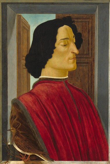 Shown from the chest up, a man with pale, yellow-tinged skin is angled to our right with downcast eyes in this vertical portrait painting. He is cleanshaven with chin-length black hair. There is a deep vertical crease in the center of his forehead between dark brows. His eyes are hazel brown, and he has a long, hooked nose over slightly parted, pale pink lips. He wears a high-necked, red tunic with deep pleats down his chest. The arm closer to us has a fawn-brown sleeve. He is shown behind a narrow ledge where a brown, dove-sized bird with an ivory-white belly sits on a twig in the lower left corner. A window opening behind the man has two wooden shutters. The shutter to the right is closed, and the one to the left is pushed open so a sliver of pale sky is visible.