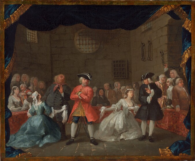 About two dozen men and women, almost all with pale skin, gather in a room with high, stone walls, with bars over the windows and iron manacles and chains hanging from the wall to our right in this horizontal painting. Most of the people are men, and many wear knee-length, long sleeved jackets, breeches, and stockings, and some wear white wigs. Three men and two women create a loose line across the stone floor, close to us. Near the center, a man stands wearing a coral-red coat with gold-colored buttons, navy-blue breeches, white stockings, buckled, black shoes, and a black tricorn hat. He faces us with his arms crossed over his chest and his feet planted widely apart. His ankles are manacled, and iron bars reach along his legs. To our left, a woman wearing a long, aquamarine-blue dress with a full, wide, hoop skirt kneels with arms spread wide, a handkerchief in one hand, in front of an older, portly man. He leans away from her with one hand raised, and skeleton keys hang from that wrist. To our right, a woman wearing a full, white, satin dress kneels facing us and looks up at a man wearing a black coat and hat, with white at the neck and cuffs, and white stockings. A sword hangs at his side. He holds up one hand, palm out, toward the woman in white. Both women wear pearl necklaces and white lace caps. The remaining people gather around the perimeter of the scene behind a low, brick-red wall. The head and shoulders of a boy with brown skin peeks out of the box near the man with the sword, to our right. The scene is surrounded by a band of gold and by a cobalt-blue, gold-edged curtain that flutters along the top and drapes down each side to puddle on the floor in the bottom corners.