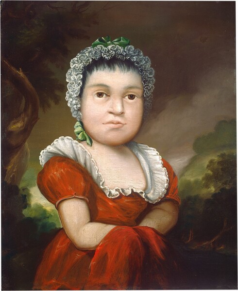 A pale-skinned child wearing a short-sleeved red dress and a white bonnet stands before a shadowy green forest under dark clouds in this vertical portrait painting. The child’s over-large head is out of scale with the rest of her body. She looks toward us with brown eyes in her wide, round-jawed face. She has a broad nose, and her pale lips are set in a line. Her lace bonnet lines her black hair like frothy seafoam and is tied with spring-green bows at the top and under her right ear, to our left. The low neckline of her crimson dress is lined with a wide white ruffle. Red fabric covers her hands, which are gathered in front of her waist. Gray clouds sweep over the hazy green forest in the background. A gnarled tree grows up the left side of the painting, framing the girl.