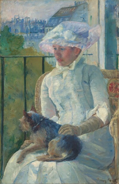 Shown from the knees up, a young woman wearing a white gown and bonnet sits in front of a balcony railing on a sunny day, holding a small dog on her lap in this vertical portrait painting. The scene is painted with visible brushstrokes, which are especially broad in the background and clothing. The woman sits with her body angled to our left, and she looks down in that direction with blue eyes. She has a short, snub nose, rosy cheeks, and her full, pink lips are parted. The woman’s bonnet is tied under her chin with a pale yellow bow. Her dress has a tightly-fitting bodice, elbow-length sleeves, and a long skirt. The bonnet and dress are painted with strokes of faint sky blue, petal pink, lavender purple, and mint green, with cream-white highlights and some darker cobalt-blue and apricot-peach strokes for shading. The dog on her lap lies with its head to our left, lifted as it looks out onto the landscape. The tan glove the woman wears on the arm we can see reaches her elbow, and she rests that hand on the dog’s back. Her right arm, to our left, is hidden below the elbow by the dog. The animal has charcoal-gray fur along its back and tan fur on the legs and shaggy face. The woman sits in a wicker armchair with a crimson-red medallion next to her left shoulder, to our right. The black balcony railing spans the width of the painting at the level of her nose, and has vertical bars. In the landscape beyond, trees to the right are painted loosely with sage green and mustard yellow. Buildings in the distance fill the top quarter of the composition, and are loosely painted with strokes of slate and aquamarine blue. The sky above is streaked with pale blush pink and ice blue. The artist signed the painting in the lower right corner, “Mary Cassatt.”