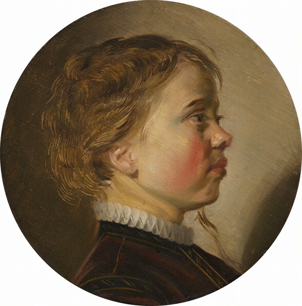 This round portrait painting shows the head, face, and the top of the shoulders of a young, blond boy with pale, peachy skin and flushed cheeks, facing our right in profile against a tan background. Light comes from behind us and to our left, so the boy’s cheek, jawline, and ear are brightly lit as he looks straight ahead, to our left. He has long, dark eyelashes, a turned-up nose, and his full, coral-pink lips are closed. The cheek we see is deeply flushed along the curve, near the nose and mouth. His short, light brown hair is highlighted with gold strands where it catches the light. A long tendril falls down past his chin on the far side of his face. He wears a fitted jacket, perhaps of brown velvet, stitched along the seams in a lighter golden color. The narrow, white ruff encircling his neck above the jacket is pleated to create a pattern of figure-eights. The background is lighter to our right and deepens to a brownish olive green to our left. The portrait is somewhat loosely painted with visible brushstrokes.