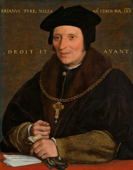 Shown from the waist up, a cleanshaven man with pale, peachy skin, wearing a black cap and a voluminous fur-lined, black cloak, is positioned behind a crimson-red ledge or tabletop in this vertical portrait painting. His head and torso nearly fills the composition. His body is angled to our left, and he looks off in that direction with dark brown eyes under faint eyebrows. His high cheeks are lightly flushed, and he has a pointed nose and a hint of a five o-clock shadow. His soft black cap has flaps that cover his ears. The wide, fur lapels of his black cloak nearly reach his shoulders. The sleeves of the garment beneath has a tan and black checked pattern, and a white undershirt peeks out at his neck and cuffs. A cross hanging from a heavy gold chain has black pearls in the cross of each arm and a teardrop-shaped black pearl hangs from the bottom. The cross has a hand on each short arm, two feet on the long leg, and a red circle at the center. The sitter’s left hand, on our right, rests on the red ledge holding a pair of gloves that are ivory white around the wrist and charcoal gray at the fingers. His right hand, father from us, rests in a loose fist near his other wrist. A folded piece of white paper with black writing lies to our left of the hands. It reads, “NVNQVID NON PAVCITAS DIERVM MEORVM FINIETVR BREVIS.” The background behind the man is mottled with rust brown and steel gray. Gold writing spans the background to either side of the man’s head, reading, “BRIANVS TVKS, MILES, ANO ETATIS EVAE LVII” along the top and “DROIT ET AVANT” below.