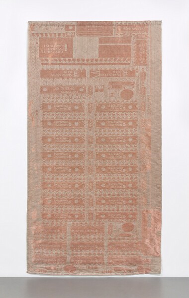 Woven with copper wire against a muted dusky-pink background, this tapestry replicates an early computer circuit board. Long, thin rectangles in two columns take up most of the height of the composition. A few rows of smaller rectangles are in three columns below and larger shapes are above. Numbers and letters, like serial numbers, including “INTEL,” can be made out on the rectangles. The copper gleams, creating a shimmering effect.