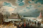 We look slightly down onto a scene showing light-skinned men, women, and children ice skating on a frozen river in this horizontal landscape painting. We get the impression of hundreds of people gathered on the ice creating a crowd that extends into the hazy distance. The couple dozen closest to us are the most defined. A few clusters of people and individuals in particular draw our attention. For example, a group of three men wearing dark cloaks and hats stand in conversation on our right. Two boys nearby hold sticks and play a game similar to hockey. A small child holds two smaller sticks, perhaps to help balance. A man in the front center wears puffy scarlet-red pants with white stockings, a red jacket, and a tall brown hat with a cloud of scarlet feathers. He stands next to a woman wearing a black hooded cloak over a black skirt and raspberry-pink bodice. She tucks her hands into a cylindrical muffler held at her waist. Another elegantly dressed man in golden yellows and black and a woman in mauve pink and butter yellow stand nearby. Some of people throughout the scene wear white frilly collars and others are more simply dressed in shades of brown, gray, and black. To our right, a faded rose-red windmill stands at the river’s edge, and to our left a large house with steeply pitched and stepped roofs is enclosed within a solid fence painted with pink diamonds against black and white. Smoke rises from one chimney, and other houses and a church line the riverbank into the distance. A wooden bridge near a grove of bare trees connects spit of land near us in the lower left corner with the village beyond. Brilliant azure-blue sky is visible through breaks in the steel-gray clouds above.