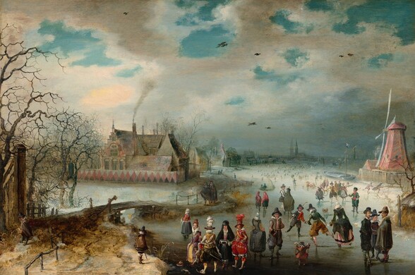 We look slightly down onto a scene showing light-skinned men, women, and children ice skating on a frozen river in this horizontal landscape painting. We get the impression of hundreds of people gathered on the ice creating a crowd that extends into the hazy distance. The couple dozen closest to us are the most defined. A few clusters of people and individuals in particular draw our attention. For example, a group of three men wearing dark cloaks and hats stand in conversation on our right. Two boys nearby hold sticks and play a game similar to hockey. A small child holds two smaller sticks, perhaps to help balance. A man in the front center wears puffy scarlet-red pants with white stockings, a red jacket, and a tall brown hat with a cloud of scarlet feathers. He stands next to a woman wearing a black hooded cloak over a black skirt and raspberry-pink bodice. She tucks her hands into a cylindrical muffler held at her waist. Another elegantly dressed man in golden yellows and black and a woman in mauve pink and butter yellow stand nearby. Some of people throughout the scene wear white frilly collars and others are more simply dressed in shades of brown, gray, and black. To our right, a faded rose-red windmill stands at the river’s edge, and to our left a large house with steeply pitched and stepped roofs is enclosed within a solid fence painted with pink diamonds against black and white. Smoke rises from one chimney, and other houses and a church line the riverbank into the distance. A wooden bridge near a grove of bare trees connects spit of land near us in the lower left corner with the village beyond. Brilliant azure-blue sky is visible through breaks in the steel-gray clouds above.
