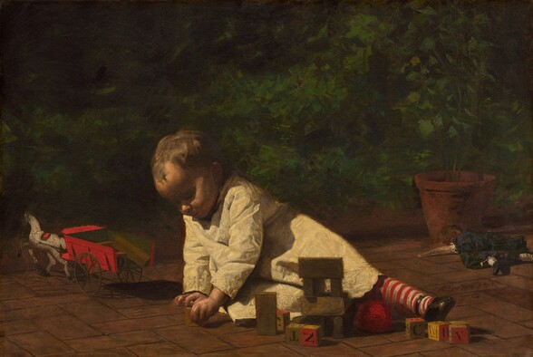 On the brick pavement of a sunny veranda, a young toddler leans heavily on her right arm, to our left, as she reaches for a wooden block in this horizontal painting. Much of her face is cast in deep shadow from the bright light overhead, but light brushes the tops of her cheeks and the tip of her nose. She grips a wooden block with her left hand, closer to us. Her left leg stretches to our right in a stocking striped with vivid red and white. Light glints off the shiny material of her black, round-toed slipper. She has short, golden-brown hair, and her white smock is richly embroidered in a pattern of white-one-white with alternating linked loops. Scattered before her, at arms-length, are seven other alphabet blocks lettered in gray with red and tan faces, several wooden building blocks, and a ball of red yarn. A doll in a black dress lies with limbs akimbo, face-down by a potted plant at the right edge of the canvas. A red wagon drawn by white toy horse sits near the left edge. The scene is enclosed with a deep, emerald-green hedge stretching across the background. The artist signed and dated this work as if he had inscribed two of the bricks on the patio with red paint in cursive script, in the lower right corner: “Eakins 76.”