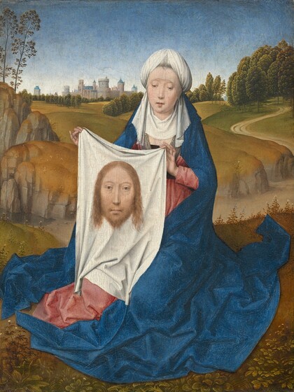 A woman sitting close to us in front of a deep landscape holds up a white cloth with the image of a man’s face on it in this vertical painting. The woman and the image on the cloth both have pale skin, hooded eyes, and long, straight noses.  The woman’s shoulders are squared toward us, and her legs are tucked under her. Her head tips slightly to our right. Her eyes are downcast, and her bow-shaped lips are parted. She wears a white, turban-like headdress with a white veil covering her neck and upper chest. Her rose-pink dress is mostly covered by a voluminous, lapis-blue robe falling from the back of the headdress to the ground, where it puddles in angular folds. On the white cloth she holds up, the man’s head has chin-length blond hair and a beard. He looks out at us with light brown eyes. The woman sits on a grassy field. A dirt path cuts through a shallow valley across the picture, not far behind the woman. More harvest-yellow and moss-green hills roll back to a town with gray stone buildings with blue roofs along the horizon, which comes three-quarters of the way up the composition. The sky above deepens from white at the horizon to azure blue across the top of the painting.