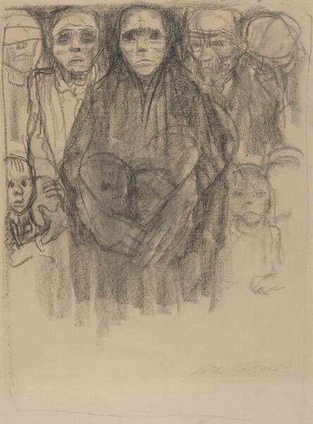 Drawn loosely with black charcoal on tan paper, this vertical sheet shows a tightly packed group of hollow-eyed, emaciated adults and children. Four men, a woman, and at least five children fill the top two-thirds of the paper, their heads nearly brushing the top edge. They all stand facing us, their mouths downturned. Dark lines and smudges suggest gaunt faces and deep-set eyes. One man on the far left has a bandage over his eyes. The men wear loose shirts, and two wear caps. The men flank a woman who stands before them in the center, looking out with shadowed eyes. She wears a dark robe with the hood pulled up. Her long arms and oversized hands are wrapped around three children gathered in front of her while two others huddle on either side. One wide-eyed child with mouth agape stands to our left, holding the forearm of the man there with both hands. The woman’s torso fades into broad, vertical charcoal strokes below the waist and a lopsided, thin border encloses the scene. The artist signed the lower right, “Kathe Kollwitz.”